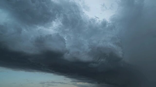 Dramatic 4K timelapse captures dark clouds overtaking sky, highlighting intense weather changes, ominous atmosphere, and powerful storm dynamics. time lapse heavy rain. cloudy rainy. lightning thunder