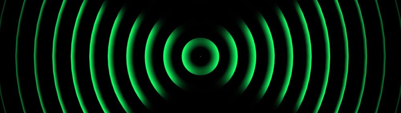 Vibrant green concentric circles radiating from a central dark circle on a black background, representing sound waves, energy pulses, or digital signals
