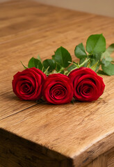 Obraz premium Romance and love concept, three red roses on a rustic wooden table for anniversary celebration, valentines day gift and floral decoration for wedding