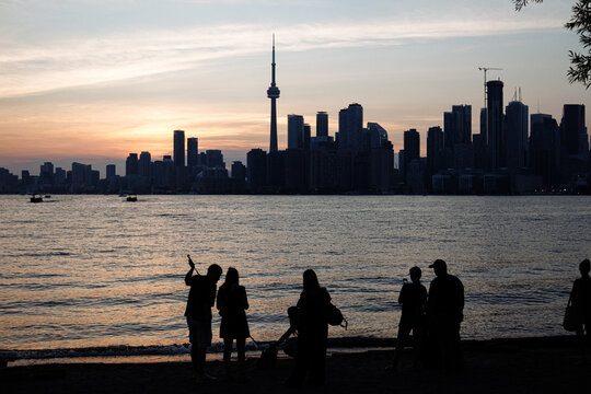 Toronto skyline with CN Tower and waterfront on Lake Ontario at sunset, Ontario, Canada. g.