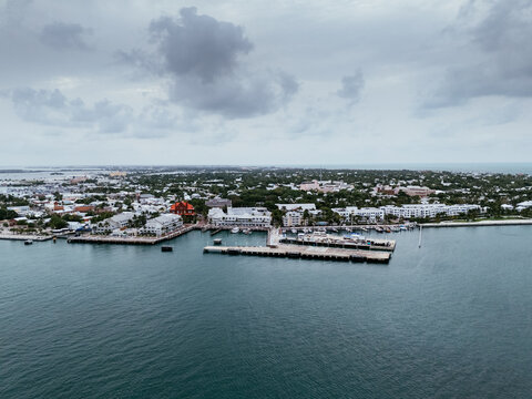 Key West, Florida, USA - view from airplane of waterfront, harbor, park, and ocean with a ship docked along the coast. g.