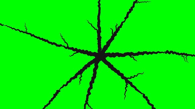 Black radial cracks and fractures on a bright green screen background for video editing and visual effects