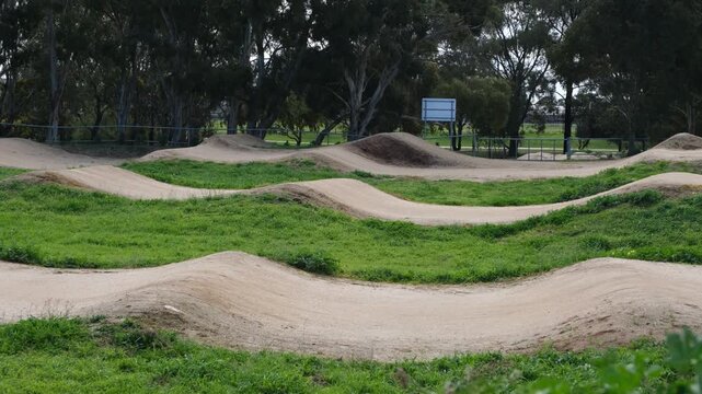 Sculpted dirt berms, rollers, and rhythm mounds designed for BMX racing track and dirt jump riding, at an outdoor municipal recreational facility&nbsp;in Melbourne, Victoria, Australia.