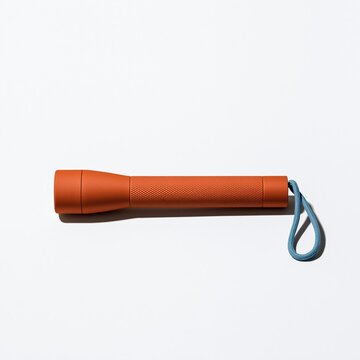 Burnt-orange hand-crank torch with a knurled grip and teal lanyard, featuring a matte finish and crisp shadows for emergency kit design and mockups