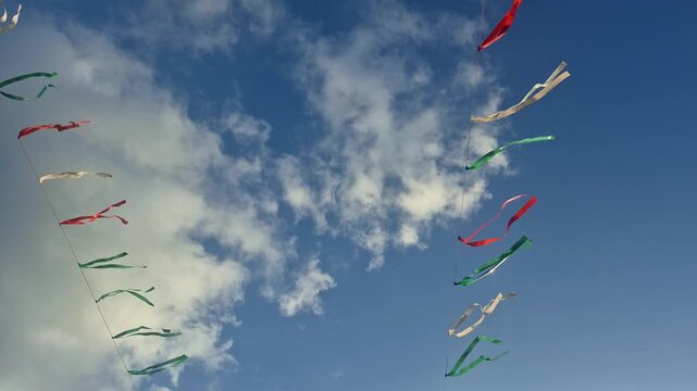 Colorful Kites Flying Against Blue Sky.