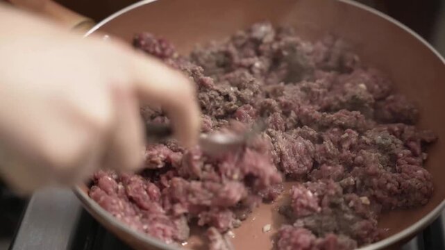 Cooking minced meat in a pan, stuffing for empanadas