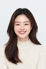 Fototapeta premium Studio Portrait Of Smiling Woman In Cream Turtleneck Knit Sweater With Dark Brown Hair