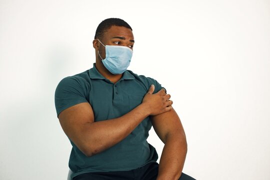 Black guy isolated on white background after covid vaccination