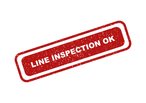 Red rectangular rubber stamp with the text line inspection ok inside