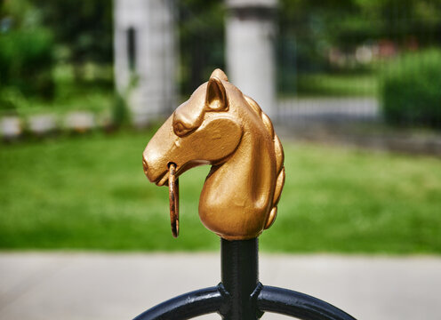  iconic golden horse head topper belongs to the historic equestrian hitching posts located throughout downtown Saratoga Springs, New York.