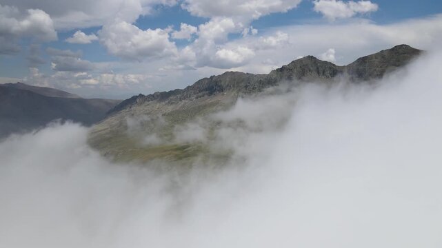 Foggy, cloudy, smoky mountains formed by steep cliffs. Peaks that are hard to reach.