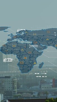 Animation of world map and data processing against aerial view of cityscape