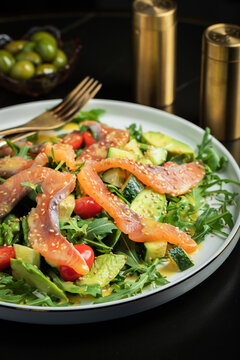 Salad with salted salmon and arugula