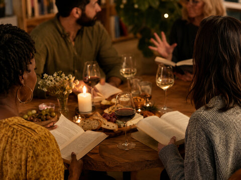 Warm Evening Book Club Gathering with Wine and Open Books