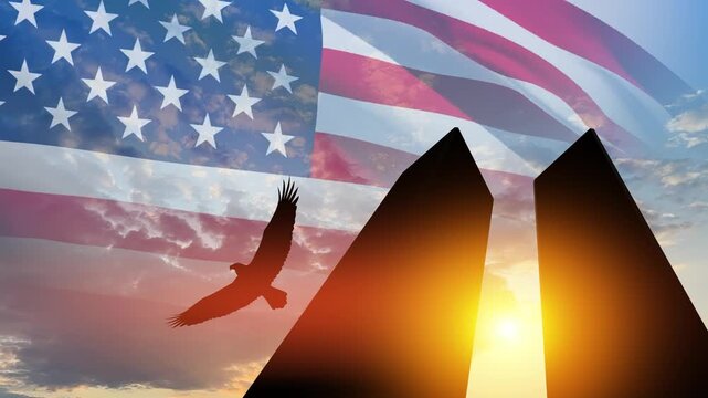 Silhouette of Towers with soaring eagle and USA flag at sunset. 09.11.2001 American Patriot Day video.