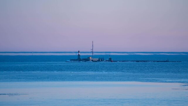 View of Fata Morgana mirage over Harmaja lighthouse, Finland. Timelapse.