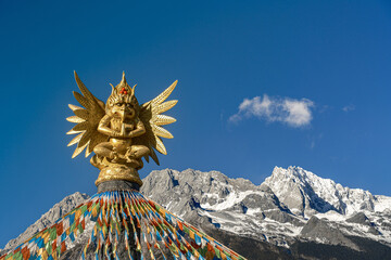 Golden Dragon God Statue with Prayer Flags, Snow Mountain Lijiang © CaoVan