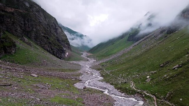 Aerial Drone View of Balu Ka Ghera on the Hampta Pass Trek Near Manali, Himachal Pradesh with Dramatic Rocky Mountains, Green Slopes and Scenic Himalayan Landscape