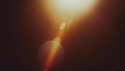 Warm lens flare and light leak background with soft bokeh glow and dark brown tones, cinematic abstract texture for photography, posters, overlays and digital design. © Bisnislogo