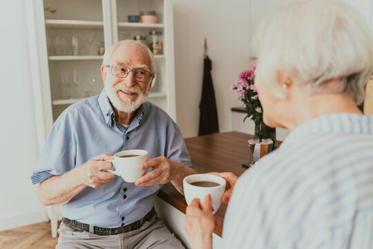 Elderly couple having breakfast at home