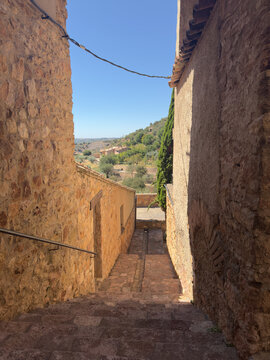Narrow stepped alley opening to the valley below Alquezar Spain