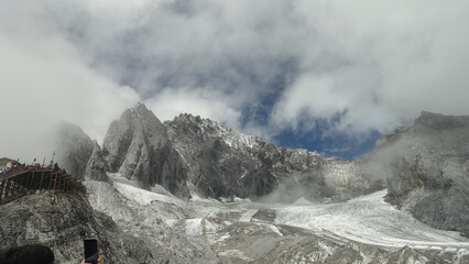 Glacier and rugged peaks in clouds at Jade Dragon Snow Mountain, Yunnan, China © HoangNgoc
