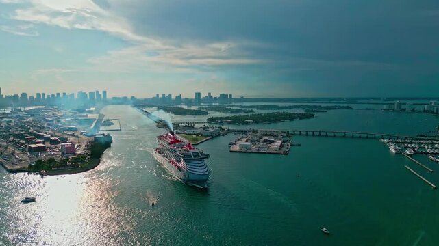 June 8, 2024 - Miami Beach, Florida: Aerial view Cruise ship Valiant Lady sailing next to Miami South Beach. Cruise ship vacation to Miami. Cruise ship Valiant Lady of Virgin Voyages