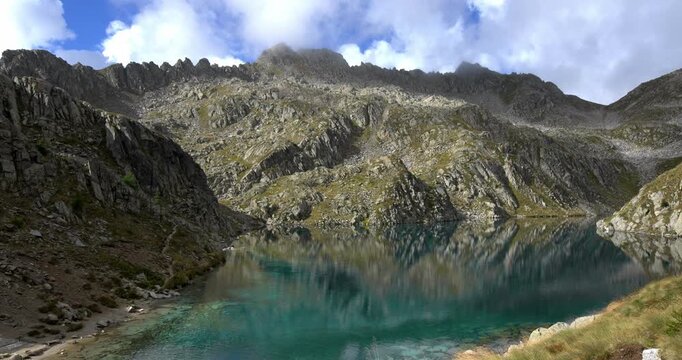 Emerald-colored waters on the Dolomite lake of Lambin