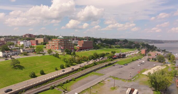 Newburgh riverfront with houses, college, marina and bridge in New York