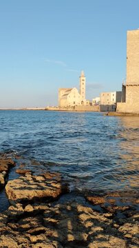 Trani town in Italy. Apulia region of Southern Italy. Cathedral of Trani - Basilica cattedrale di Maria Santissima Assunta, viewed from the sea.