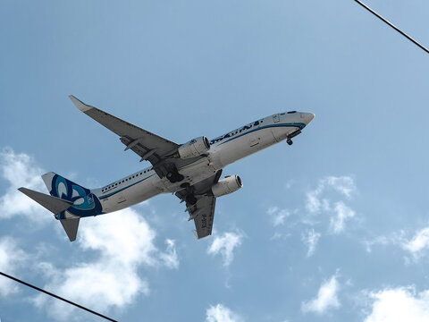 Kazakhstan, Shymkent - August 24, 2026: A Boeing commercial airliner belonging to SCAT Airlines in a blue sky with clouds. Concept for a banner dedicated to air travel or a flight themed background.