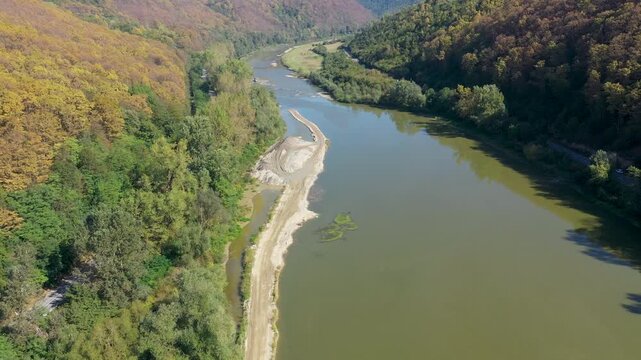  Flying over a river flowing in a gorge aerial view