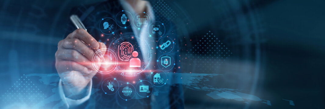 Identity verification. Security specialist using laptop configuring facial recognition algorithms, fingerprint scan access logs, and iris authentication databases on secure server network.