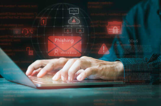 Programmer typing on laptop with cyber attack threat concept. Phishing email, ransomware folder, DDoS attempt, man in the middle, network vulnerability, data security, and malware.