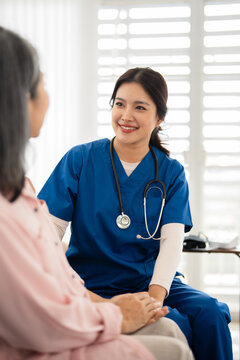 Female  doctor provide emotional support and encouragement to an elderly woman during a home healthcare consultation.