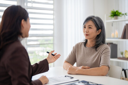 Brokers, insurance agents, or financial planners discuss and provide advise about health insurance for senior people.