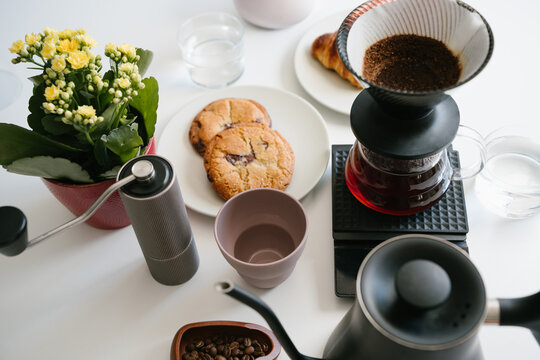 Crafting Fresh V60 Coffee at Home for a Cozy Breakfast with Sweet Cookies and Morning Pastries