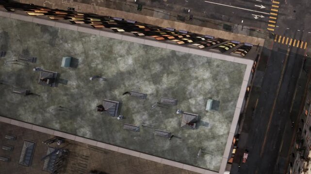 Aerial view shows a busy street in a city with tall buildings on either side. Cars are on the road while the layout reveals intersections and patterns of architecture.