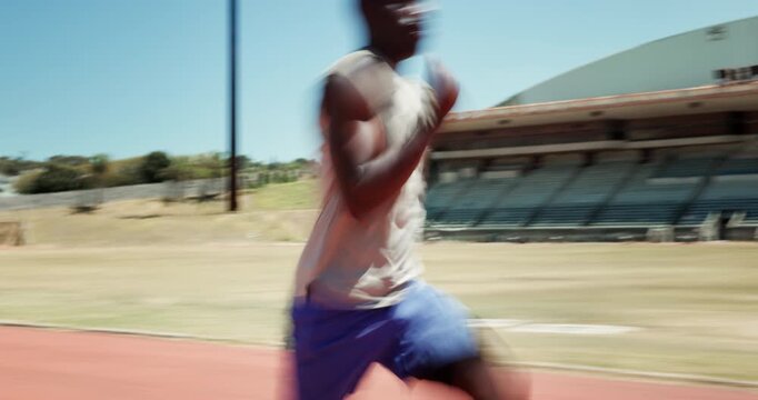 Black man, sprint and fast on track, start and fitness at stadium for training with motion blur in summer. Person, athlete and outdoor with running, speed and workout for development in Jamaica