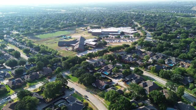 Curving roadways border large school grounds throughout scenic Northwest Dallas County zones. Tidy residential parcels span tranquil neighborhoods across scenic Coppell, Texas