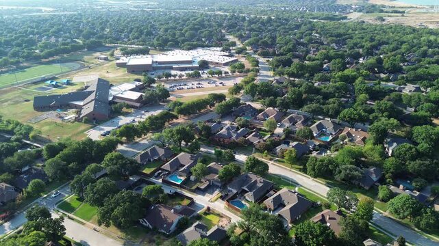 Educational campuses overlook curved residential avenues across classic Greater Dallas tracts. Shaded lots frame charming single family dwellings throughout peaceful Coppell, Texas