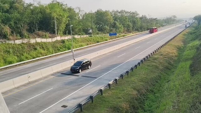 Red Intercity Bus and Cars Driving on Open Highway Road