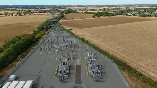Aerial view of Ryhall 400kV electrical substation and transformer units in rural Rutland UK