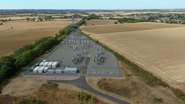 Aerial view of Ryhall 400kV electrical substation and transformer units in rural Rutland UK