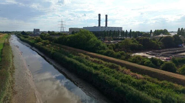 Aerial view of a large combined cycle gas turbine CCGT power station with twin exhaust stacks in Lincolnshire, England, United Kingdom