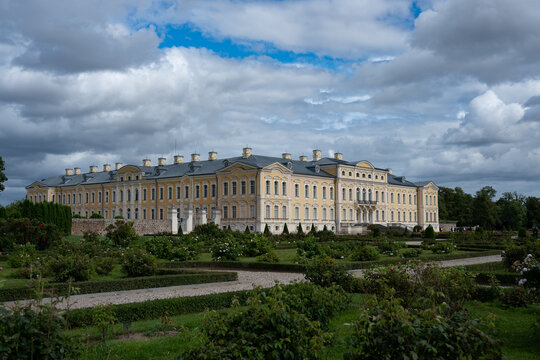 Rundale Palace Exterior and Garden View Under Dramatic Cloudy Sky in Latvia