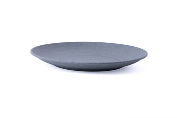 Empty minimalist matte grey ceramic shallow plate isolated on a white background