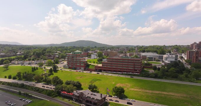 Newburgh riverfront with houses, college and bridge in New York