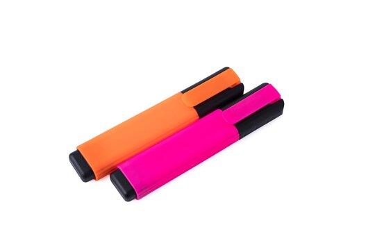 Pink and orange fluorescent highlighter marker pens isolated on a white background