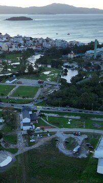 Solar Energy Technology Center with Rooftop Solar Panels, Ground-Mounted Arrays and Photovoltaic Research Systems in Florian&oacute;polis, Brazil. Aerial View. Vertical video.
